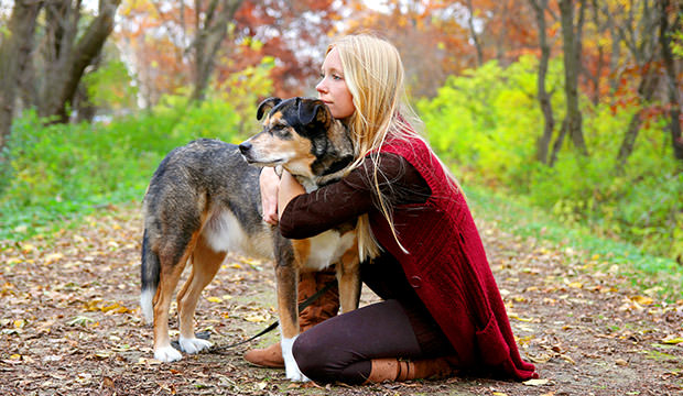 bigstock-Womann-Woods-And-Pet-Dog-Relax-74582998
