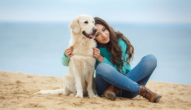 bigstock-Young-woman-with-her-dog-on-th-76846400