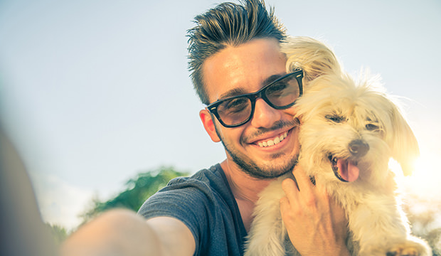bigstock-young-man-and-his-dog-taking-a-73517944
