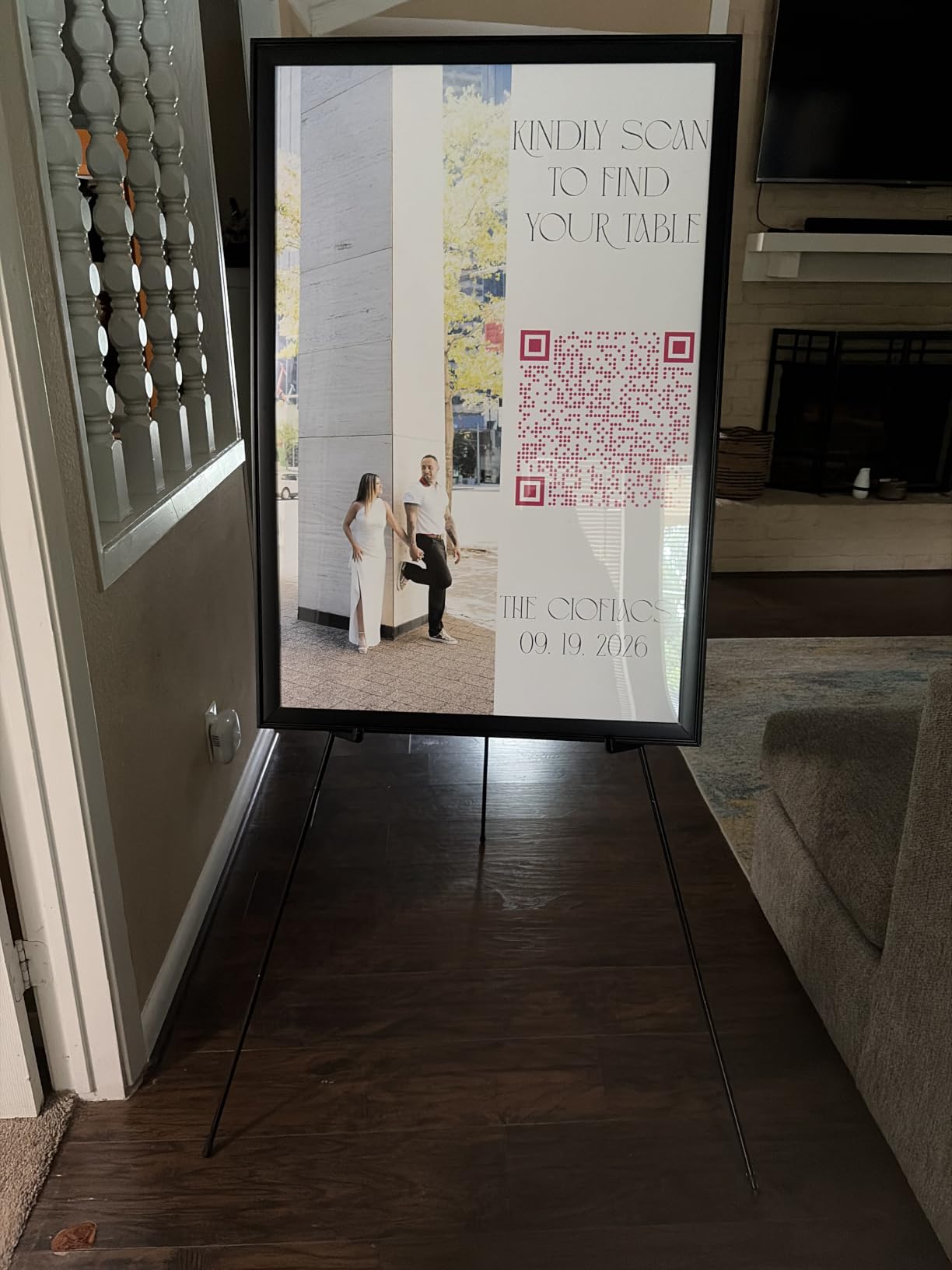 Amazon Basics Easel Display Stand, Instant Floor Poster, Lightweight, Collapsible and Portable with Tripod Base, Black Steel (supports 5 pounds) customer photo 1