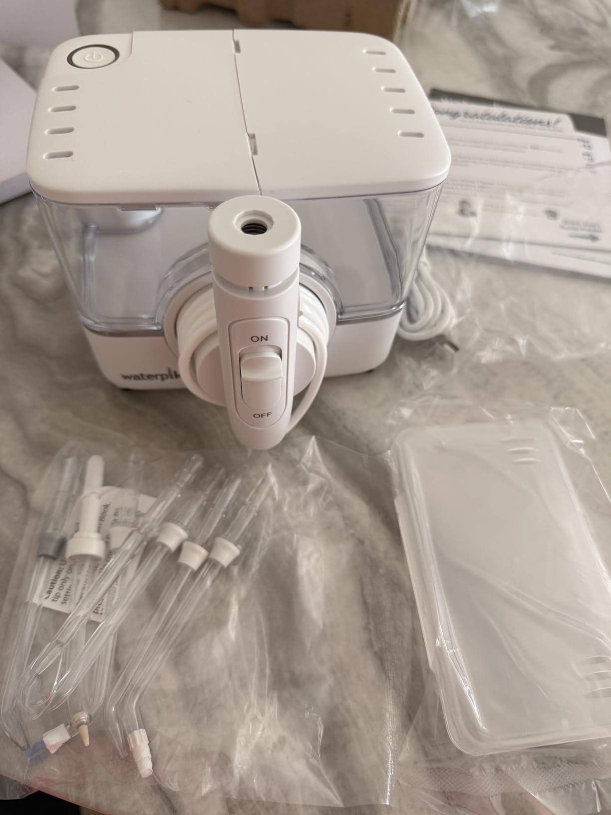 Waterpik ION Rechargeable Water Flosser with 10 Settings, 7 Tips, White customer photo 2